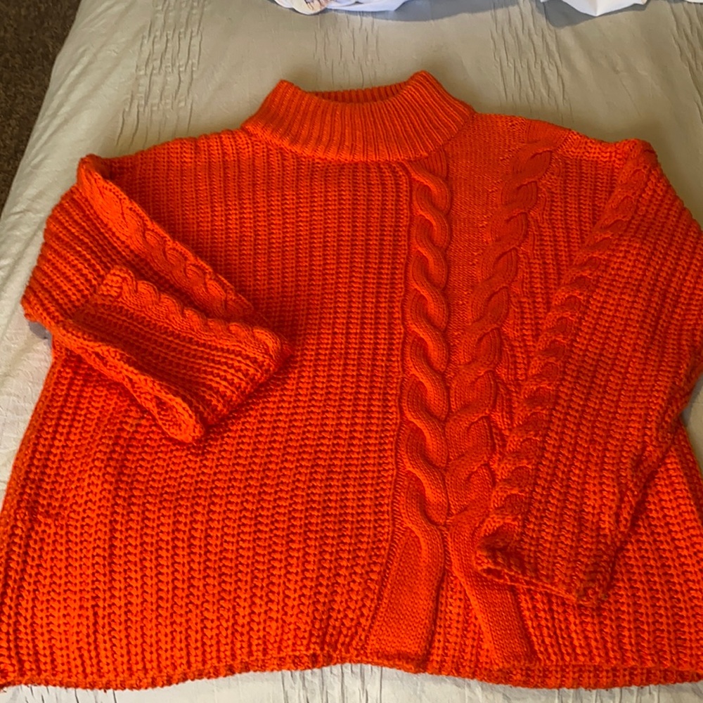 Bright orange, oversized turtle neck sweater